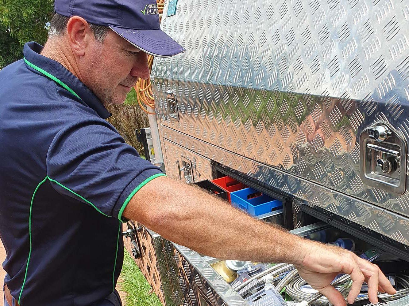 water filters being installed by water smart plumbing
